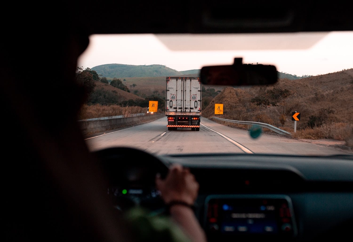 Negligence Behind the Wheel: Common Factors That Lead to Tragic Trucking Accidents
